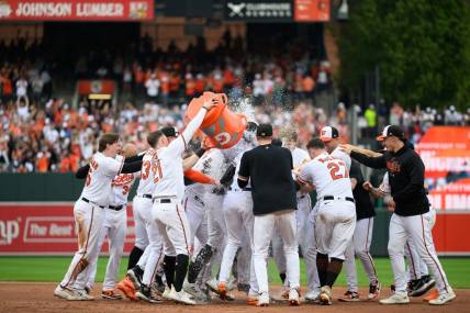 Sep 17, 2023; Baltimore, Maryland, USA; The Baltimore Orioles celebrate after winning the game against the Tampa Bay Rays at Oriole Park at Camden Yards. Mandatory Credit: Reggie Hildred-USA TODAY Sports