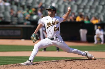 Sep 17, 2023; Oakland, California, USA; Oakland Athletics starting pitcher Ken Waldichuk (64) throws a pitch against the San Diego Padres during the seventh inning at Oakland-Alameda County Coliseum. Mandatory Credit: Darren Yamashita-USA TODAY Sports
