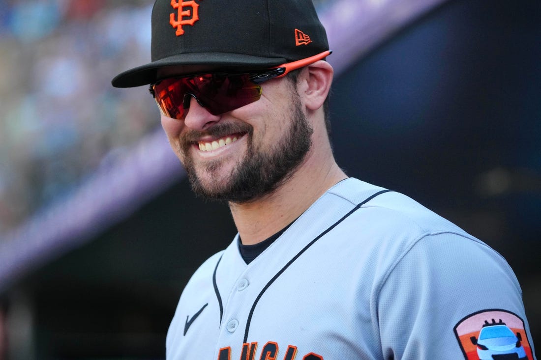 Sep 17, 2023; Denver, Colorado, USA;  San Francisco Giants third baseman J.D. Davis (7) reacts in the seventh inning against the Colorado Rockies at Coors Field. Mandatory Credit: Ron Chenoy-USA TODAY Sports