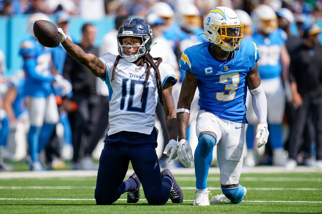 Tennessee Titans wide receiver DeAndre Hopkins (10) celebrates receiving a pass next to Los Angeles Chargers safety Derwin James Jr. (3) during the fourth quarter at Nissan Stadium in Nashville, Tenn., Sunday, Sept. 17, 2023.