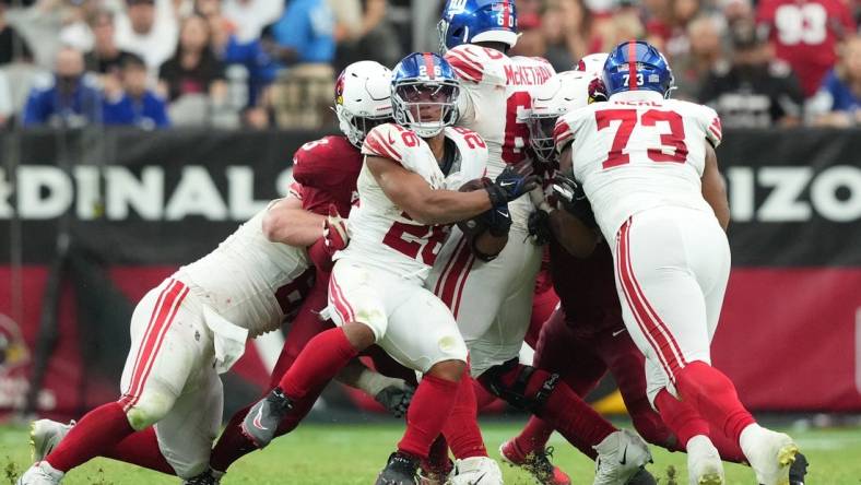 Sep 17, 2023; Glendale, Arizona, USA; New York Giants running back Saquon Barkley (26) runs against the Arizona Cardinals during the second half at State Farm Stadium. Mandatory Credit: Joe Camporeale-USA TODAY Sports