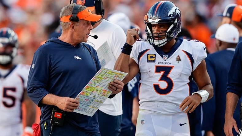 Sep 17, 2023; Denver, Colorado, USA; Denver Broncos head coach Sean Payton talks with quarterback Russell Wilson (3) in the fourth quarter against the Washington Commanders at Empower Field at Mile High. Mandatory Credit: Isaiah J. Downing-USA TODAY Sports