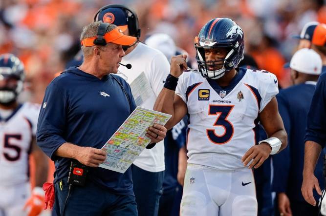 Sep 17, 2023; Denver, Colorado, USA; Denver Broncos head coach Sean Payton talks with quarterback Russell Wilson (3) in the fourth quarter against the Washington Commanders at Empower Field at Mile High. Mandatory Credit: Isaiah J. Downing-USA TODAY Sports