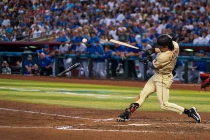 Sep 17, 2023; Phoenix, Arizona, USA; Arizona Diamondbacks outfielder Corbin Carroll (7) breaks his bat during his at bat in the fourth inning against the Chicago Cubs at Chase Field. Mandatory Credit: Allan Henry-USA TODAY Sports