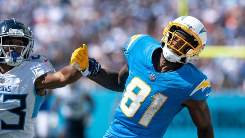 Los Angeles Chargers wide receiver Mike Williams (81) can't catch up to an overthrown pass while defended by Tennessee Titans cornerback Tre Avery (23) during their NFL game at Nissan Stadium Sunday afternoon, Sept. 17, 2023.