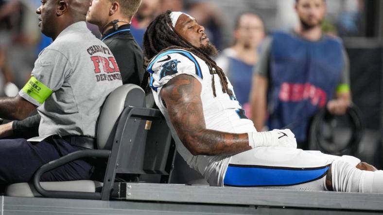 Sep 18, 2023; Charlotte, North Carolina, USA; Carolina Panthers linebacker Shaq Thompson (7) is carted to the locker room after an injury  during the first quarter against the New Orleans Saints at Bank of America Stadium. Mandatory Credit: Jim Dedmon-USA TODAY Sports