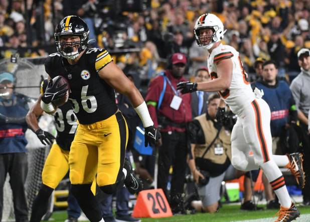 Sep 18, 2023; Pittsburgh, Pennsylvania, USA;  Pittsburgh Steelers linebacker Alex Highsmith (56) returns an interception for a touchdown as Cleveland Browns wide receiver Harrison Bryant (88) watches the score at Acrisure Stadium. Mandatory Credit: Philip G. Pavely-USA TODAY Sports