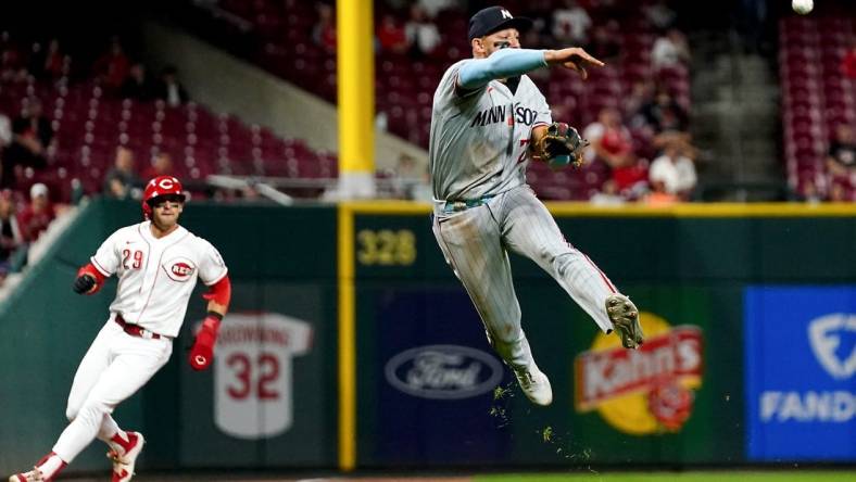 Minnesota Twins third baseman Royce Lewis (23) throws to first base for an out in the seventh inning of a baseball game against the Cincinnati Reds, Monday, Sept. 18, 2023, at Great American Ball Park in Cincinnati.