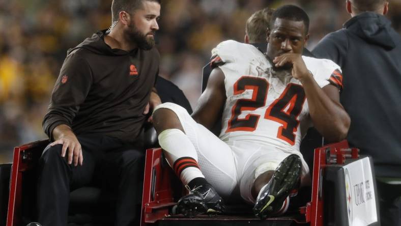 Sep 18, 2023; Pittsburgh, Pennsylvania, USA;  Cleveland Browns running back Nick Chubb (24) is taken from the field on a cart after suffering an apparent injury against the Pittsburgh Steelers during the second quarter at Acrisure Stadium. Mandatory Credit: Charles LeClaire-USA TODAY Sports