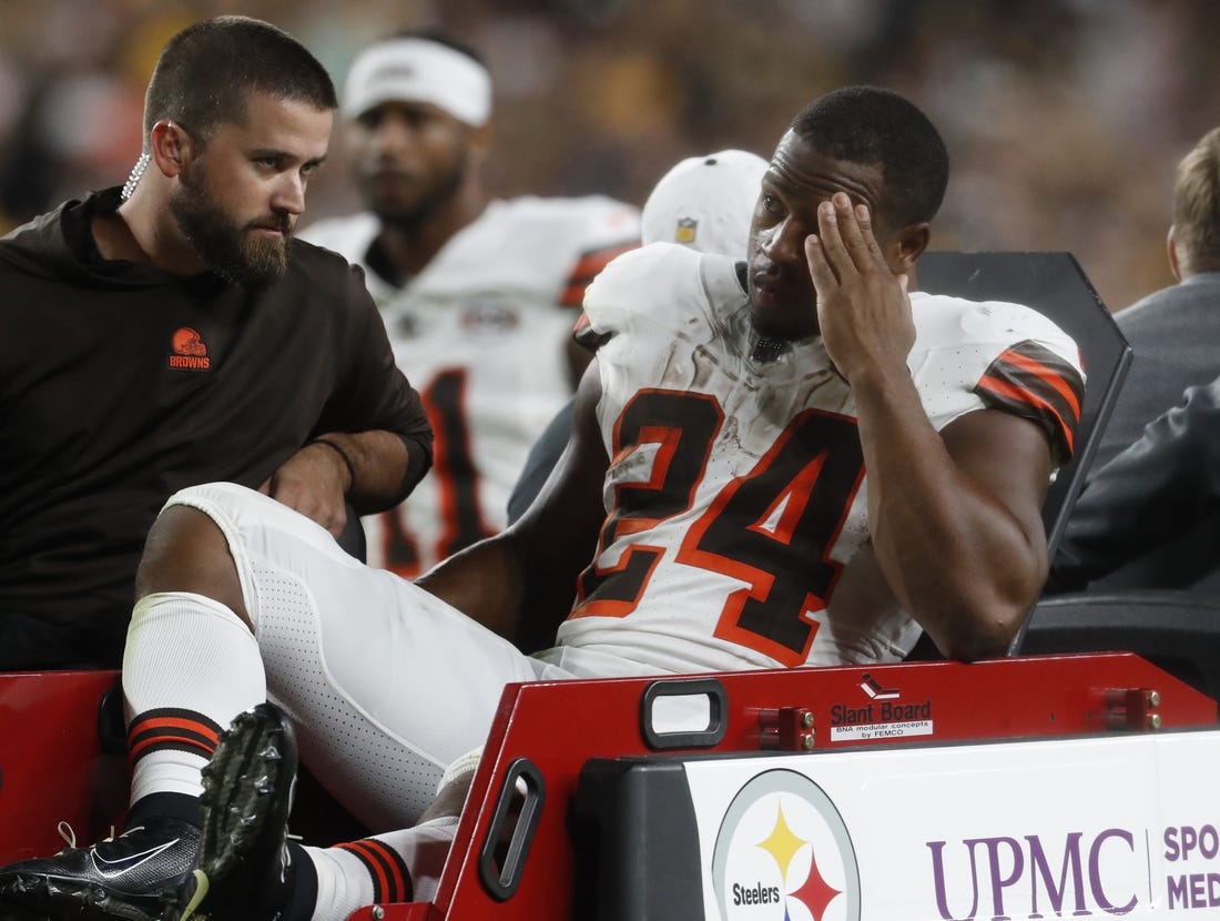 Sep 18, 2023; Pittsburgh, Pennsylvania, USA;  Cleveland Browns running back Nick Chubb (24) is taken from the field on a cart after suffering an apparent injury against the Pittsburgh Steelers during the second quarter at Acrisure Stadium. Mandatory Credit: Charles LeClaire-USA TODAY Sports