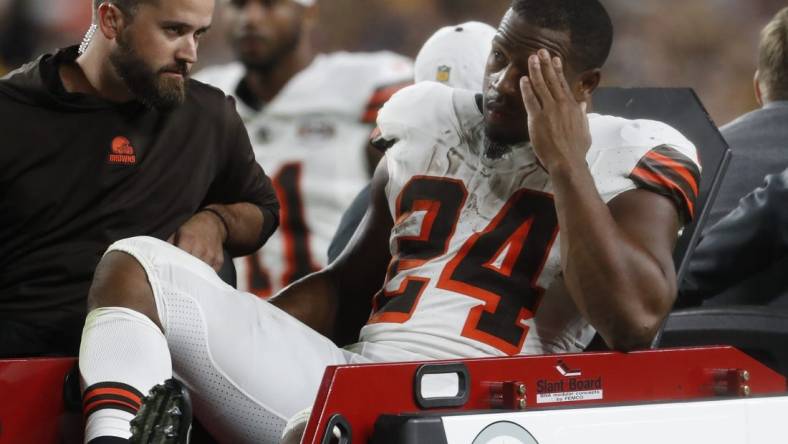 Sep 18, 2023; Pittsburgh, Pennsylvania, USA;  Cleveland Browns running back Nick Chubb (24) is taken from the field on a cart after suffering an apparent injury against the Pittsburgh Steelers during the second quarter at Acrisure Stadium. Mandatory Credit: Charles LeClaire-USA TODAY Sports