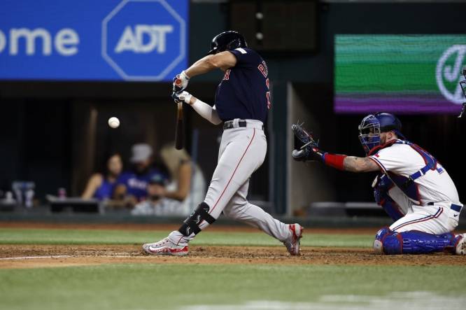 Sep 18, 2023; Arlington, Texas, USA; Boston Red Sox left fielder Rob Refsnyder (30) hits a two run single in the eighth inning against the Texas Rangers at Globe Life Field. Mandatory Credit: Tim Heitman-USA TODAY Sports