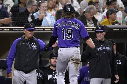 Sep 18, 2023; San Diego, California, USA; Colorado Rockies right fielder Charlie Blackmon (19) is congratulated at the dugout by manager Bud Black (left) after scoring a run against the San Diego Padres during the third inning at Petco Park. Mandatory Credit: Orlando Ramirez-USA TODAY Sports