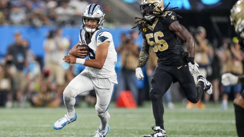 Sep 18, 2023; Charlotte, North Carolina, USA; New Orleans Saints linebacker Demario Davis (56) chases Carolina Panthers quarterback Bryce Young (9) during the second half at Bank of America Stadium. Mandatory Credit: Jim Dedmon-USA TODAY Sports