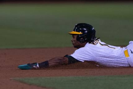 Sep 18, 2023; Oakland, California, USA;  Oakland Athletics center fielder Esteury Ruiz (1) slides during the eighth inning against Seattle Mariners at Oakland-Alameda County Coliseum. Mandatory Credit: Stan Szeto-USA TODAY Sports