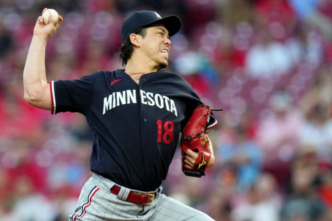 Minnesota Twins starting pitcher Kenta Maeda (18) delivers a pitch in the second inning of a baseball game against the Minnesota Twins, Tuesday, Sept. 19, 2023, at Great American Ball Park in Cincinnati.