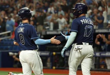 Sep 19, 2023; St. Petersburg, Florida, USA;  Tampa Bay Rays second baseman Brandon Lowe (8) and third baseman Isaac Paredes (17) celebrate as they both score during the eighth inning against the Los Angeles Angels at Tropicana Field. Mandatory Credit: Kim Klement Neitzel-USA TODAY Sports