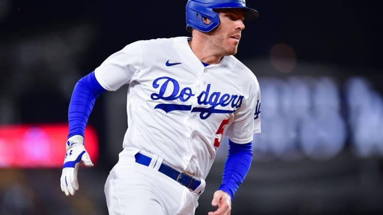 Sep 19, 2023; Los Angeles, California, USA; Los Angeles Dodgers first baseman Freddie Freeman (5) advances to third against the Detroit Tigers during the first inning at Dodger Stadium. Mandatory Credit: Gary A. Vasquez-USA TODAY Sports