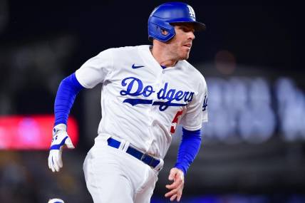 Sep 19, 2023; Los Angeles, California, USA; Los Angeles Dodgers first baseman Freddie Freeman (5) advances to third against the Detroit Tigers during the first inning at Dodger Stadium. Mandatory Credit: Gary A. Vasquez-USA TODAY Sports