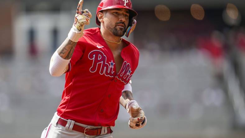 Sep 20, 2023; Cumberland, Georgia, USA; Philadelphia Phillies right fielder Nick Castellanos (8) reacts after hitting a home run against the Atlanta Braves during the second inning  at Truist Park. Mandatory Credit: Dale Zanine-USA TODAY Sports