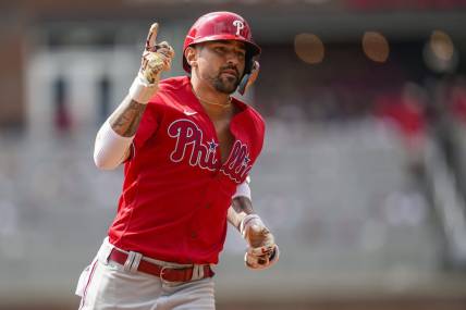 Sep 20, 2023; Cumberland, Georgia, USA; Philadelphia Phillies right fielder Nick Castellanos (8) reacts after hitting a home run against the Atlanta Braves during the second inning  at Truist Park. Mandatory Credit: Dale Zanine-USA TODAY Sports