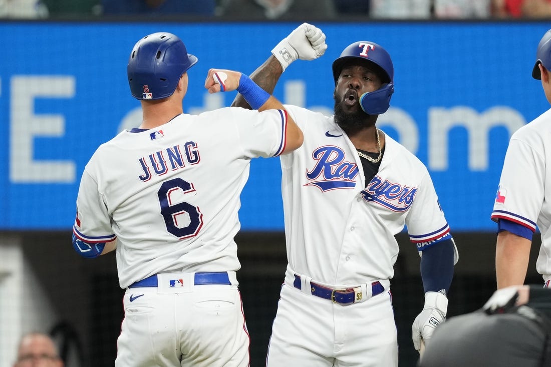 Sep 20, 2023; Arlington, Texas, USA; Texas Rangers third baseman Josh Jung (6) celebrates his solo home run with right fielder Adolis Garcia (53) against the Boston Red Sox during the fifth inning at Globe Life Field. Mandatory Credit: Jim Cowsert-USA TODAY Sports