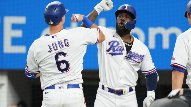 Sep 20, 2023; Arlington, Texas, USA; Texas Rangers third baseman Josh Jung (6) celebrates his solo home run with right fielder Adolis Garcia (53) against the Boston Red Sox during the fifth inning at Globe Life Field. Mandatory Credit: Jim Cowsert-USA TODAY Sports