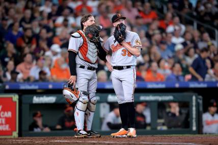 Sep 20, 2023; Houston, Texas, USA; Baltimore Orioles catcher Adley Rutschman (35) talks with Baltimore Orioles starting pitcher Kyle Bradish (39) during an umpire meeting during the sixth inning against the Houston Astros at Minute Maid Park. Mandatory Credit: Erik Williams-USA TODAY Sports