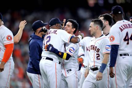 Sep 20, 2023; Houston, Texas, USA; Houston Astros center fielder Mauricio Dubon (14) celebrates with Houston Astros manager Dusty Baker Jr (12) after hitting a walk off single against the Baltimore Orioles during the ninth inning at Minute Maid Park. Mandatory Credit: Erik Williams-USA TODAY Sports