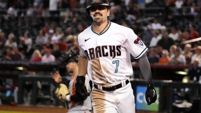 Arizona Diamondbacks rookie Corbin Carroll (7) smiles after hitting his 25th home run against the San Francisco Giants in the seventh inning at Chase Field in Phoenix on Sept. 20, 2023.