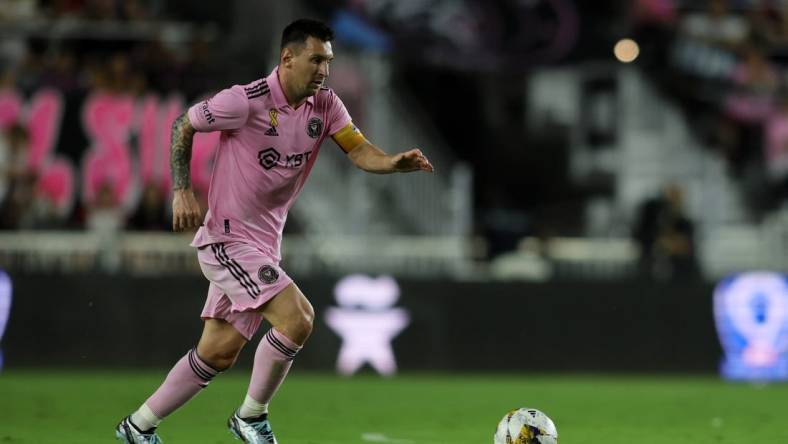 Sep 20, 2023; Fort Lauderdale, Florida, USA; Inter Miami forward Lionel Messi (10) kicks the ball against the Toronto FC during the first half at DRV PNK Stadium. Mandatory Credit: Sam Navarro-USA TODAY Sports