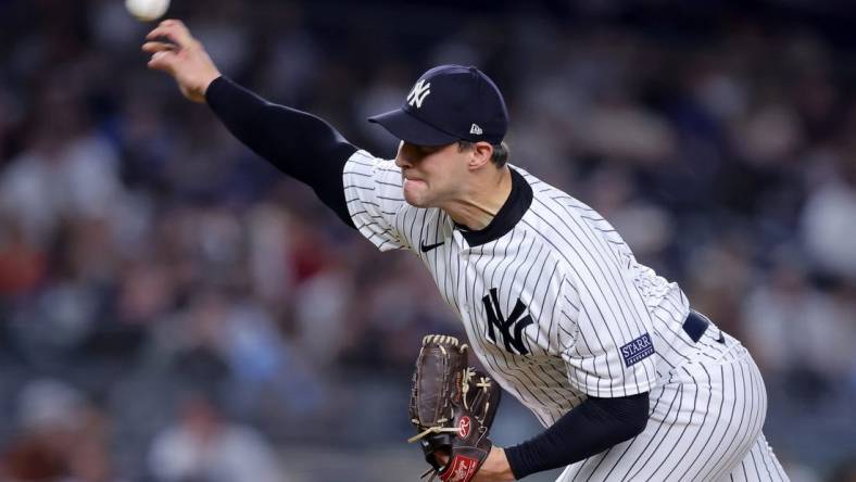 Sep 20, 2023; Bronx, New York, USA; New York Yankees relief pitcher Tommy Kahnle (41) pitches against the Toronto Blue Jays during the eighth inning at Yankee Stadium. Mandatory Credit: Brad Penner-USA TODAY Sports