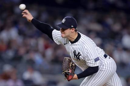 Sep 20, 2023; Bronx, New York, USA; New York Yankees relief pitcher Tommy Kahnle (41) pitches against the Toronto Blue Jays during the eighth inning at Yankee Stadium. Mandatory Credit: Brad Penner-USA TODAY Sports