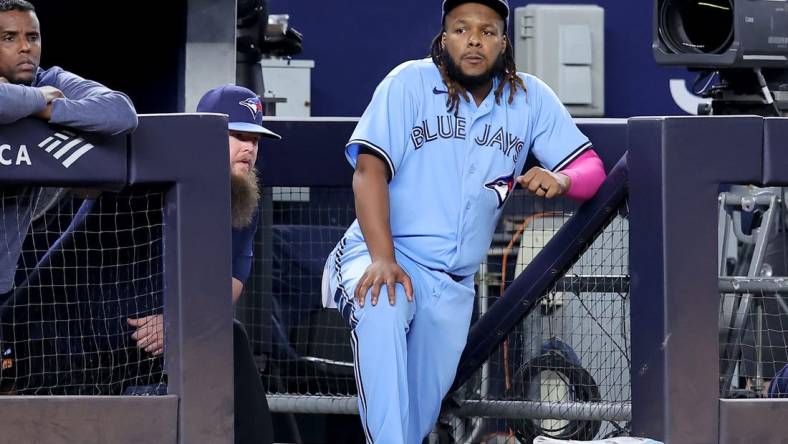 Sep 20, 2023; Bronx, New York, USA; Toronto Blue Jays designated hitter Vladimir Guerrero Jr. (27) watches from the dugout during the eighth inning against the New York Yankees at Yankee Stadium. Mandatory Credit: Brad Penner-USA TODAY Sports