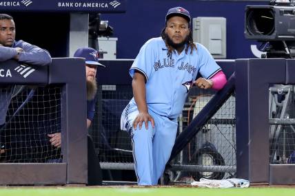 Sep 20, 2023; Bronx, New York, USA; Toronto Blue Jays designated hitter Vladimir Guerrero Jr. (27) watches from the dugout during the eighth inning against the New York Yankees at Yankee Stadium. Mandatory Credit: Brad Penner-USA TODAY Sports