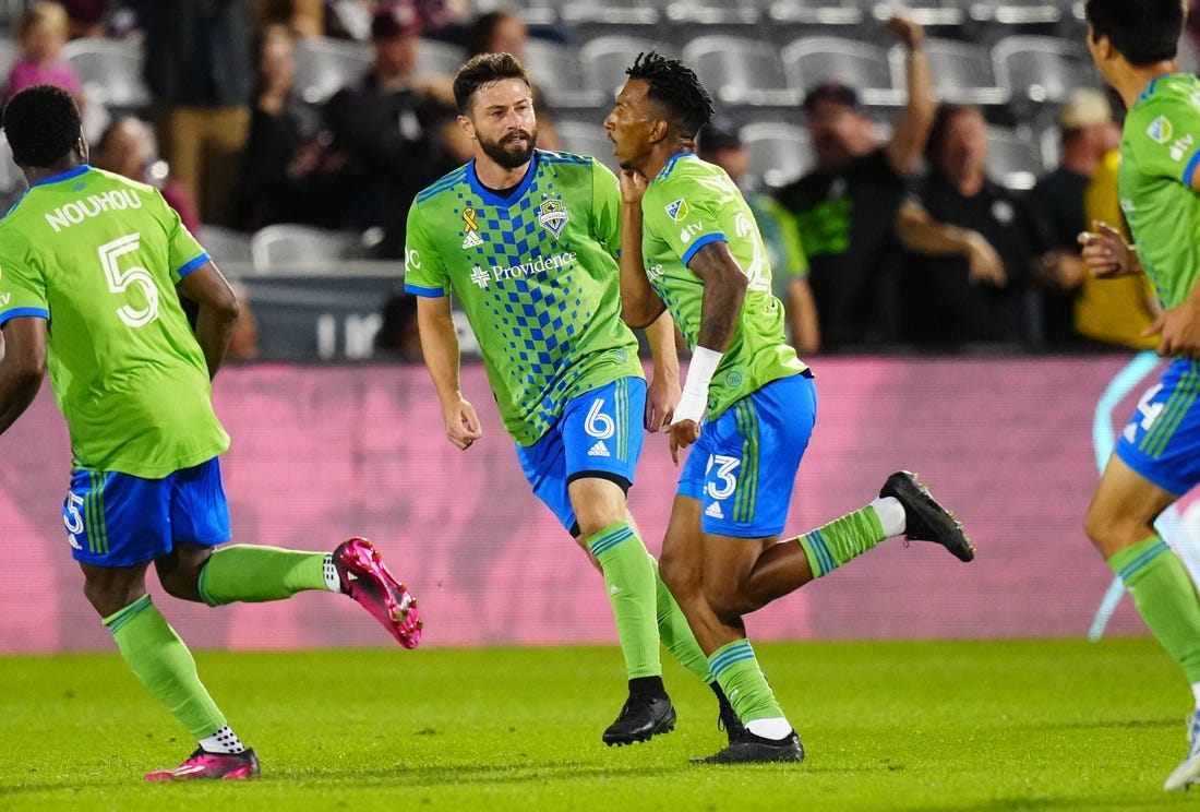 Sep 20, 2023; Commerce City, Colorado, USA; Seattle Sounders midfielder Joao Paulo (6) and Leo Chu (23) celebrate a goal in the first half at Dick's Sporting Goods Park. Mandatory Credit: Ron Chenoy-USA TODAY Sports