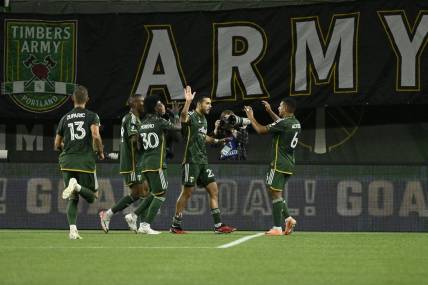 Sep 20, 2023; Portland, Oregon, USA;  Portland Timbers midfielder Cristhian Paredes (22) celebrates with teammates after scoring against San Jose Earthquakes during the first half at Providence Park. Mandatory Credit: Troy Wayrynen-USA TODAY Sports