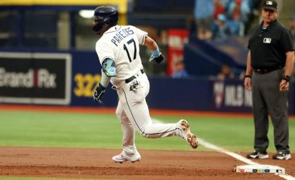 Sep 21, 2023; St. Petersburg, Florida, USA; Tampa Bay Rays third baseman Isaac Paredes (17) hits a RBI double against the Los Angeles Angels at Tropicana Field. Mandatory Credit: Kim Klement Neitzel-USA TODAY Sports