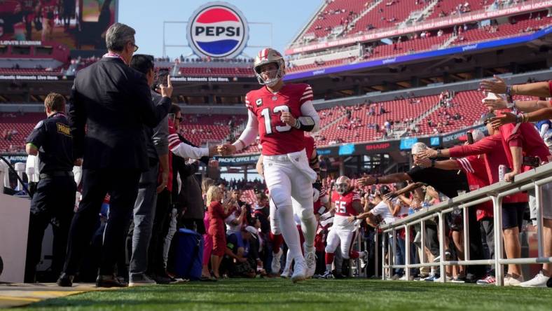 Sep 21, 2023; Santa Clara, California, USA; San Francisco 49ers quarterback Brock Purdy (13) jogs onto the field before the game against the New York Giants at Levi's Stadium. Mandatory Credit: Cary Edmondson-USA TODAY Sports