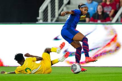 Sep 21, 2023; Cincinnati, Ohio, USA;  United States defender Crystal Dunn (19) dribbles the ball against South Africa defender Lebogang Ramalepe (2) in the first half at TQL Stadium. Mandatory Credit: Aaron Doster-USA TODAY Sports
