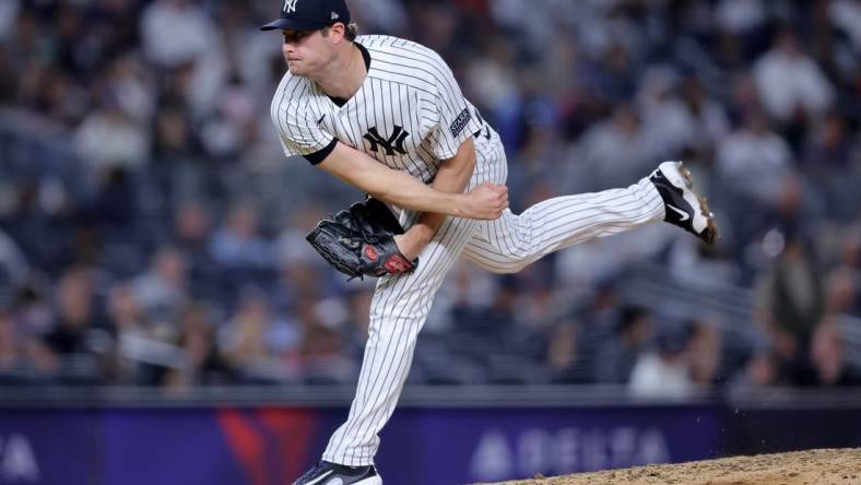 Sep 21, 2023; Bronx, New York, USA; New York Yankees starting pitcher Gerrit Cole (45) follows through on a pitch against the Toronto Blue Jays during the fifth inning at Yankee Stadium. Mandatory Credit: Brad Penner-USA TODAY Sports