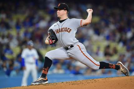 Sep 21, 2023; Los Angeles, California, USA; San Francisco Giants starting pitcher Kyle Harrison (45) throws against the Los Angeles Dodgers during the second inning at Dodger Stadium. Mandatory Credit: Gary A. Vasquez-USA TODAY Sports