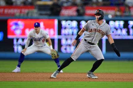 Sep 21, 2023; Los Angeles, California, USA; San Francisco Giants center fielder Tyler Fitzgerald (49) leads off from second against the Los Angeles Dodgers during the seventh inning at Dodger Stadium. Mandatory Credit: Gary A. Vasquez-USA TODAY Sports