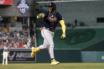Sep 22, 2023; Washington, District of Columbia, USA; Atlanta Braves right fielder Ronald Acuna Jr. (13) celebrates while rounding the bases after hitting his 40th home run of the season against the Washington Nationals during the first inning at Nationals Park. Mandatory Credit: Amber Searls-USA TODAY Sports