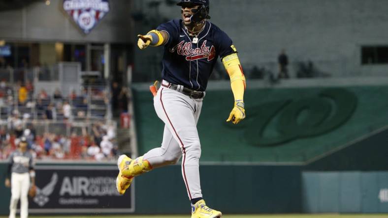 Sep 22, 2023; Washington, District of Columbia, USA; Atlanta Braves right fielder Ronald Acuna Jr. (13) celebrates while rounding the bases after hitting his 40th home run of the season against the Washington Nationals during the first inning at Nationals Park. Mandatory Credit: Amber Searls-USA TODAY Sports