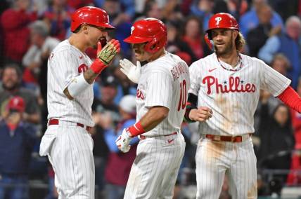 Sep 22, 2023; Philadelphia, Pennsylvania, USA; Philadelphia Phillies catcher J.T. Realmuto (10) celebrates with right fielder Nick Castellanos (8) and designated hitter Bryce Harper (3) after hitting a three run home run during the sixth inning against the New York Mets at Citizens Bank Park. Mandatory Credit: Eric Hartline-USA TODAY Sports
