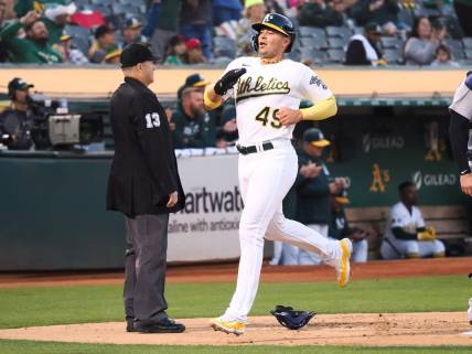 Sep 22, 2023; Oakland, California, USA; Oakland Athletics first baseman Ryan Noda (49) scores a run against the Detroit Tigers during the first inning at Oakland-Alameda County Coliseum. Mandatory Credit: Kelley L Cox-USA TODAY Sports