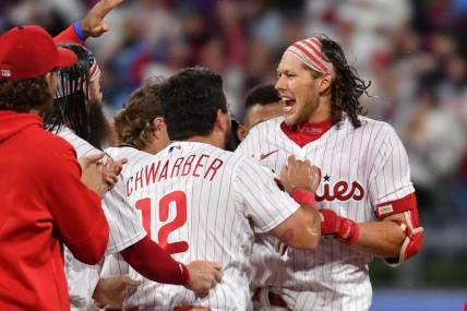 Sep 22, 2023; Philadelphia, Pennsylvania, USA; Philadelphia Phillies first baseman Alec Bohm (28) celebrates his walk-off single with teammates during the tenth inning against the New York Mets at Citizens Bank Park. Mandatory Credit: Eric Hartline-USA TODAY Sports