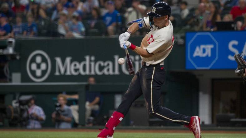 Sep 22, 2023; Arlington, Texas, USA; Texas Rangers center fielder left Carter (32) bats against the Seattle Mariners during the game at Globe Life Field. Mandatory Credit: Jerome Miron-USA TODAY Sports