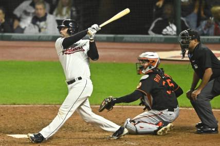 Sep 22, 2023; Cleveland, Ohio, USA; Cleveland Guardians catcher David Fry (12) hits a game-winning, two-RBI double in the ninth inning against the Baltimore Orioles at Progressive Field. Mandatory Credit: David Richard-USA TODAY Sports